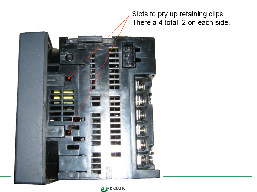 Slots to pry up retaining clips